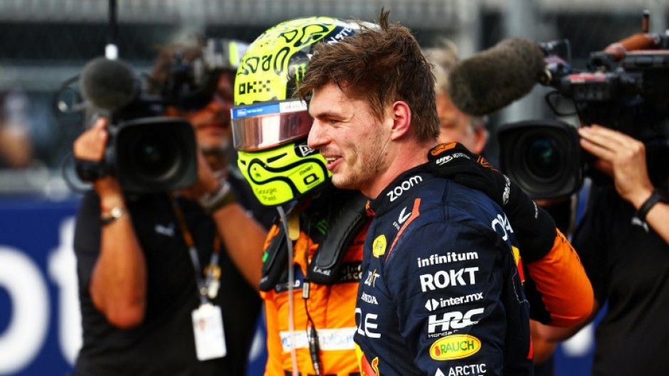 'Iconic track': Max Verstappen (R) with Lando Norris after the British driver won the Miami Grand Prix 
