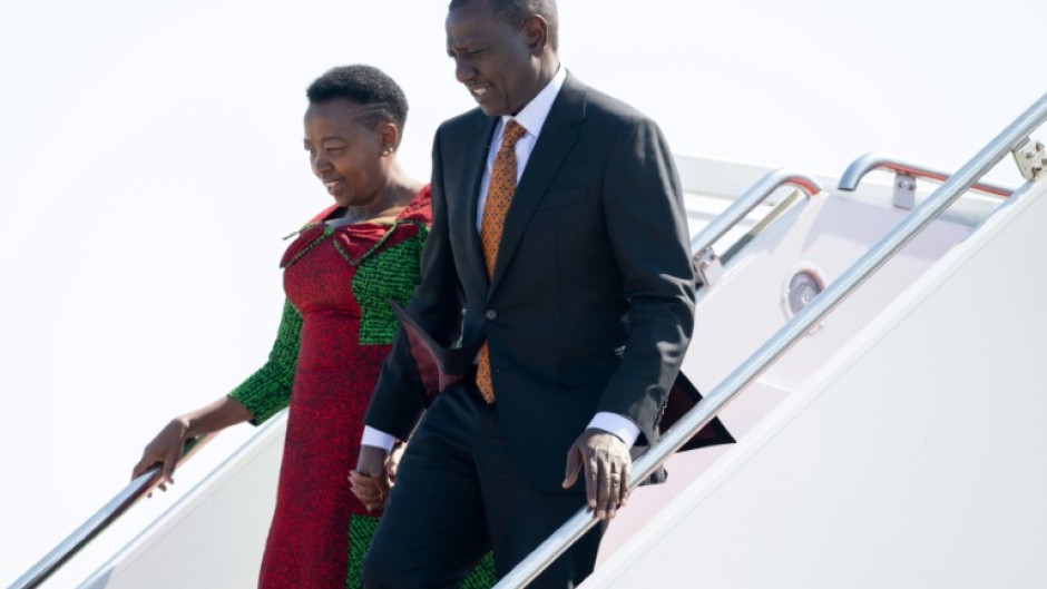 Kenyan President William Ruto and his wife, First Lady Rachel Ruto, disembark from their airplane on arrival in Washington