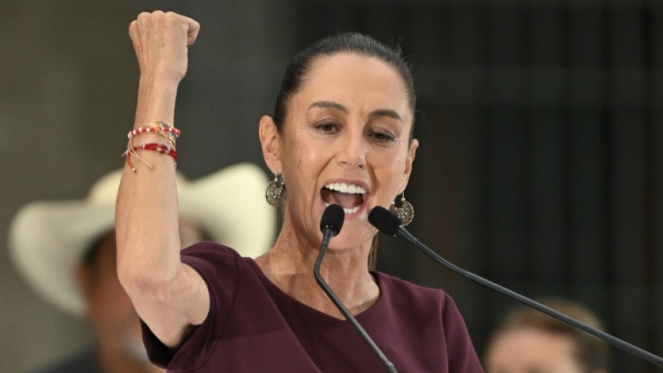 Mexican ruling party presidential candidate Claudia Sheinbaum shows her inked finger as she votes