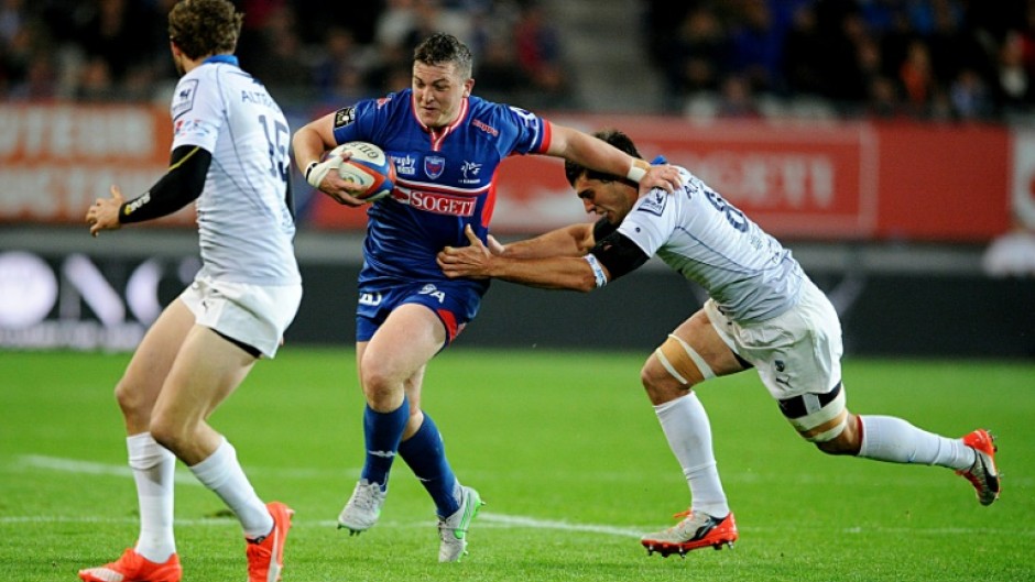 Irishman Denis Coulson (centre) is one of three players accused of rape