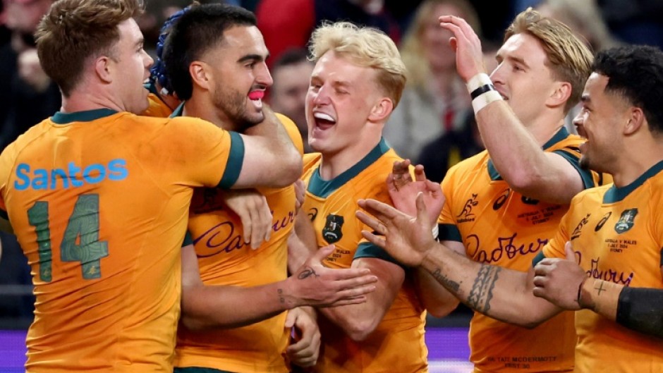 Australia celebrate after beating Wales 25-16