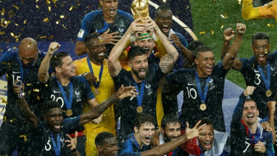 Olivier Giroud holds aloft the World Cup trophy in 2018