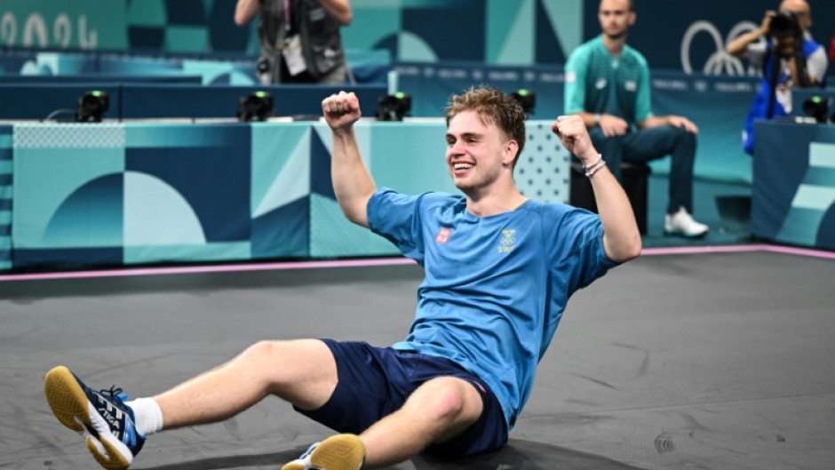 Sweden's Truls Moregard celebrates after winning against China's Wang Chuqin 
