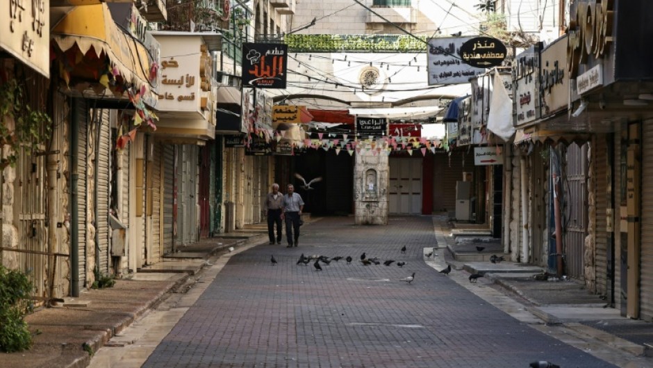 Shops are shuttered in the West Bank city of Nablus as Palestinian observe a general strike in protest at the killing of Hamas leader Isamail Haniyeh in an air strike in Tehran