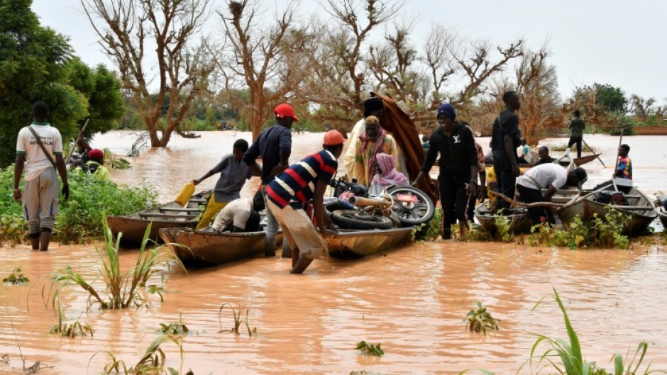 In Niger, people were forced to use canoes after heavy rains damaged main roads