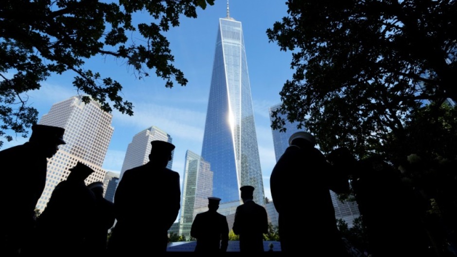 People look at the names of victims on the South Tower Memorial Pool during  during the 23rd anniversary of the September 11 terror attack on the World Trade Center at Ground Zero, in New York City on September 11, 2024.