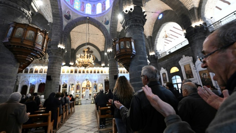 Worshippers attend Sunday Mass at the Cathedral of Our Lady of the Dormition, known also as the Olive Church, in Syria's capital Damascus