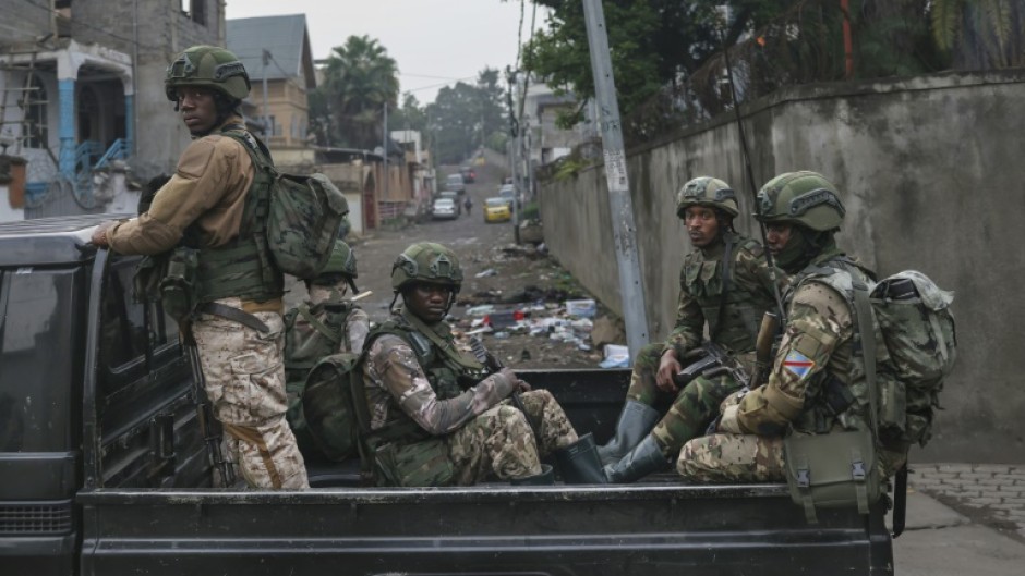 Members of the M23 armed group during a patrol in Goma, a vital trading hub that they mostly now control 