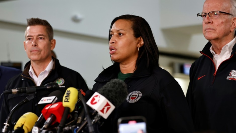 Officials including US Secretary of Transportation Sean Duffy (L) and Washington Mayor Muriel Bowser (C) address a media briefing at Reagan National Airport 