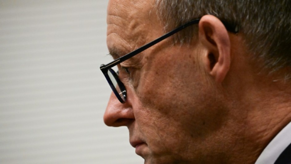 CDU leader Friedrich Merz gets ready to give a statement after German MPs narrowly voted against his party's bill to restrict immigration 