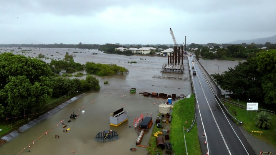 Rising floodwaters swamp areas around Townsville in northeastern Australia