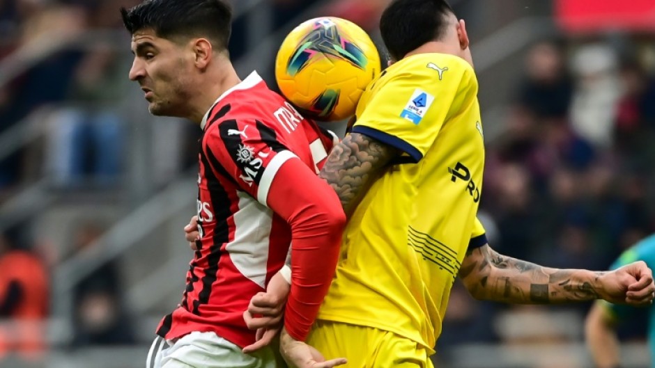 AC Milan's Spanish forward Alvaro Morata (L) in action during a Serie A game against Parma at the San Siro