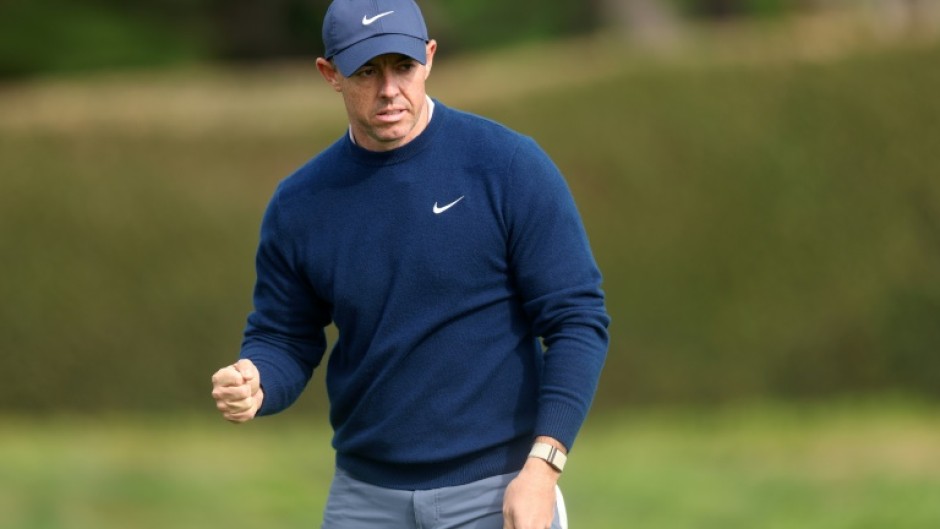 Third-ranked Rory McIlroy of Northern Ireland celebrates sinking an eagle putt at the 14th hole in the final round on his way to victory at the PGA Pebble Beach Pro-Am