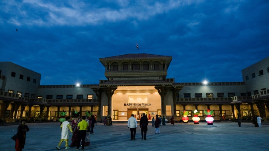 Devotees arrived before sunrise for the consecration ceremony and opening the BAPS Hindu Mandir