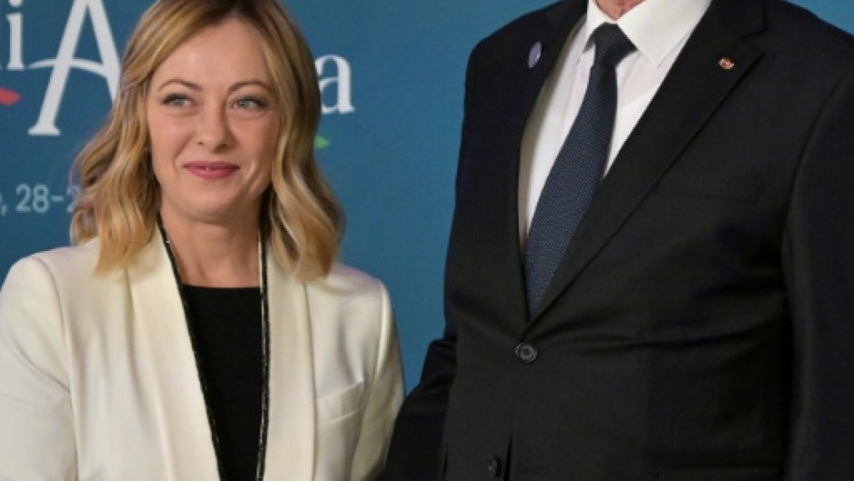 Italy's Prime Minister Giorgia Meloni greets Tunisia's President Kais Saied