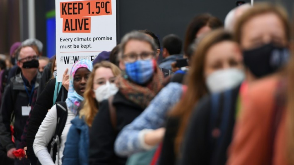 Climate activists hold a protest action during the COP26 UN Climate Change Conference in Glasgow on November 12, 2021