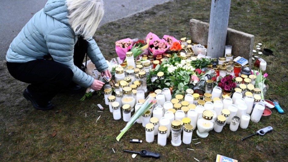 Tributes were left at the adult education centre where 10 people were killed by a gunman on Tuesday