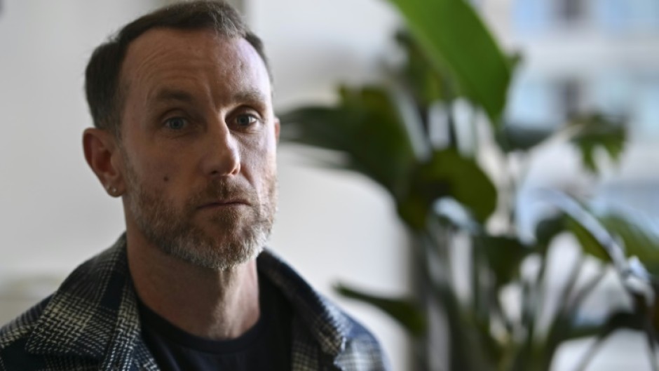 Joseph Lynskey, who survived being pushed onto subway tracks in front of an oncoming train on December 31, 2024, sits during an interview with AFP in New York City