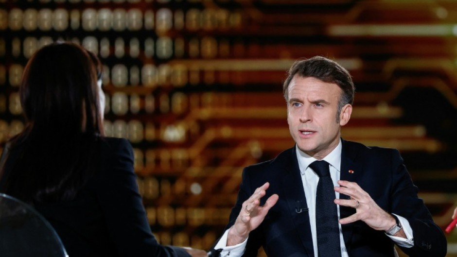 Macron (R) talked up French tech firms in a TV interview