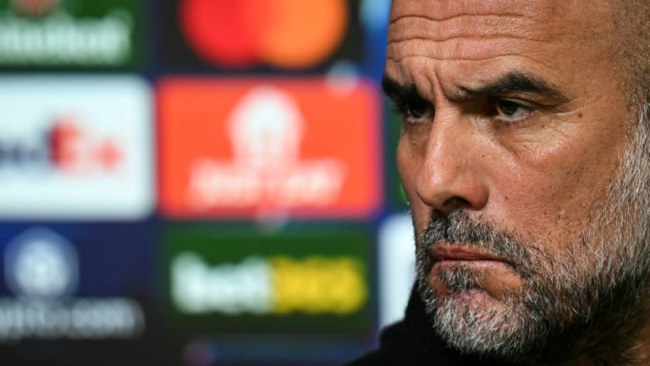 Manchester City manager Pep Guardiola speaks to the press on the eve of the first leg of their Champions League playoff against Real Madrid