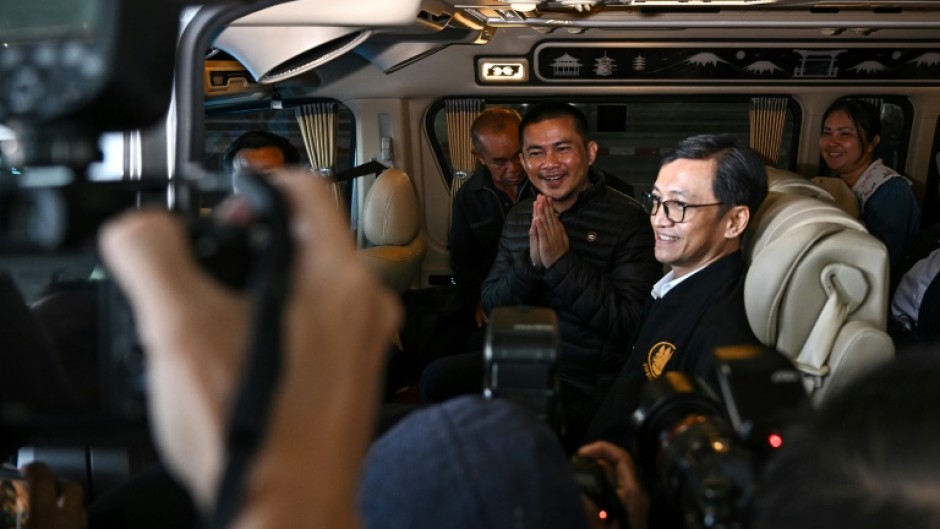 Freed Thai national Pongsak Thaenna leaves in a car after his return to Thailand with four others released after being held hostage in Gaza for more than a year