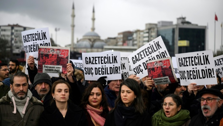 Demonstrators gathered outside the Istanbul courthouse where the BirGun journalists were taking with banners reading: 'Journalism is not a crime' 