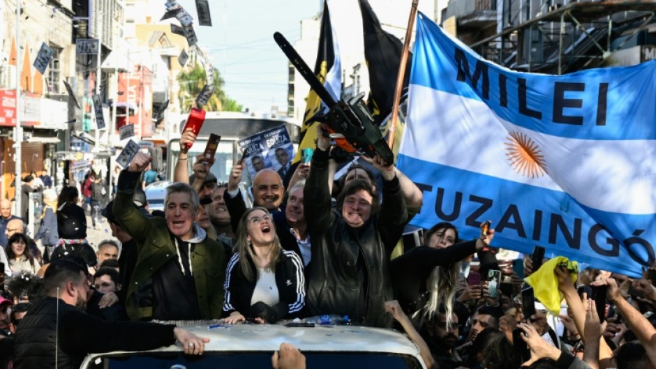 Javier Milei waves a chainsaw during a campaign rally in San Martin, Buenos Aires province, Argentina in September 2023