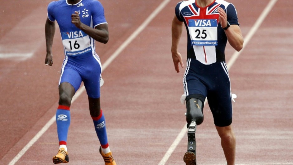 John McFall, right, running in the 2007 Paralympics. He has now been cleared to fly to the ISS