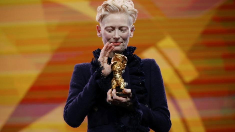 Tilda Swinton lashed out at 'greed-addicted governments' in her acceptance speech for a special award at the Berlin Film Festival