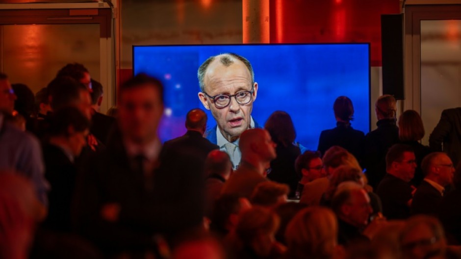 Friedrich Merz is seen on a screen during the TV debate in Berlin ahead of elections on February 23