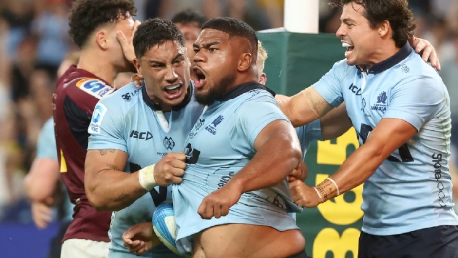 NSW Waratahs' Siosifa Amone (C) celebrates his winning try against the Otago Highlanders 