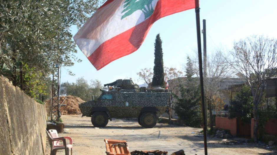 Lebanese army soldiers guard the entrance of the southern Lebanese village of Houla on February 17, 2025