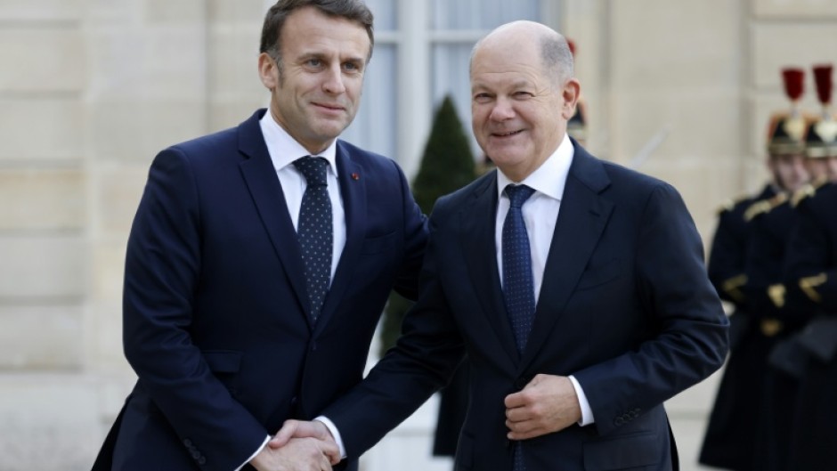 Germany's Chancellor Olaf Scholz (R) said he was 'a little irritated' by suggestions of sending troops