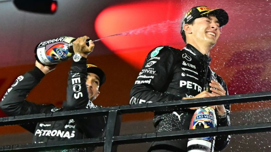 George Russell (R) with runner-up and then Mercedes team-mate Lewis Hamilton (L) after winning last season's Las Vegas Grand Prix