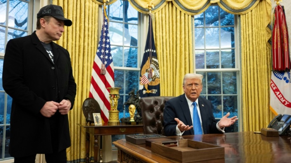 Elon Musk listens as US President Donald Trump speaks in the Oval Office of the White House 