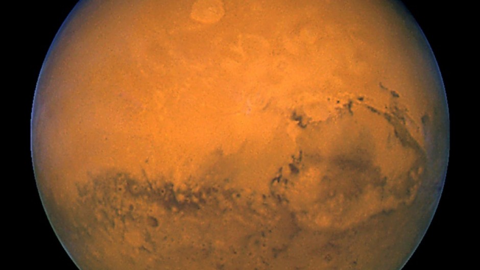 A file photo taken 27 August 2003 by NASA's Hubble Space Telescope shows Mars snapped within minutes of the planet's closest approach to Earth in nearly 60,000 years