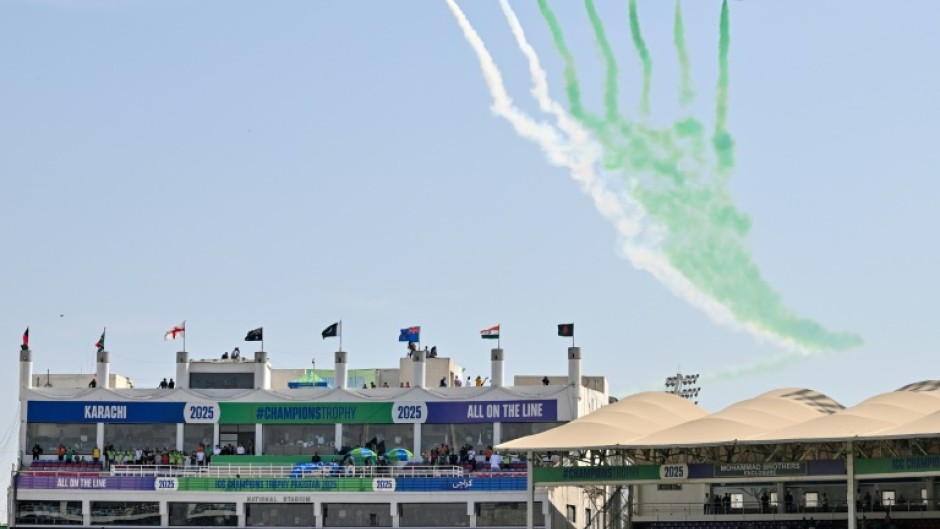 Pakistan Air Force jets fly over the National Stadium in Karachi at the opening ceremony of the ICC Champions Trophy tournament