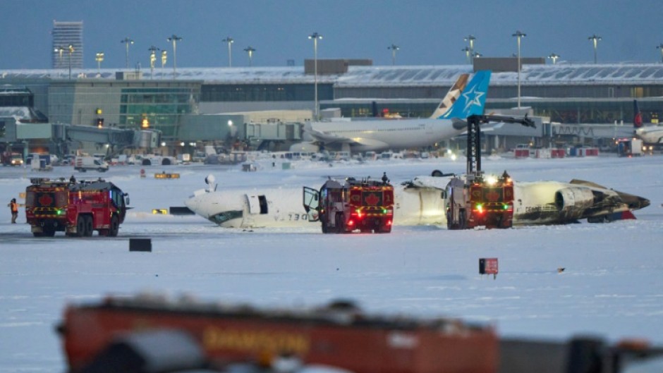 A fireball and thick plumes of black smoke engulfed the plane as it skidded to a halt on its roof