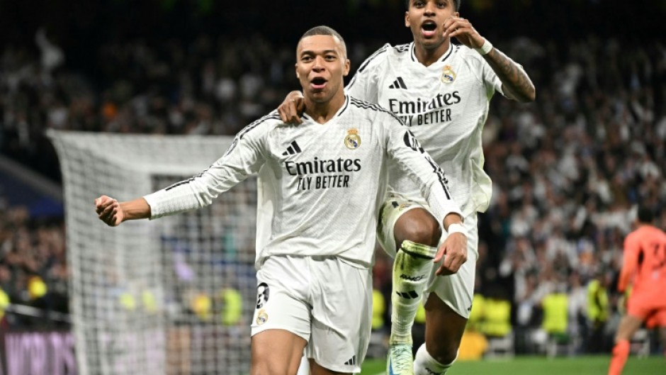 Real Madrid's French forward Kylian Mbappe celebrates scoring his team's second goal in the rout of Man City
