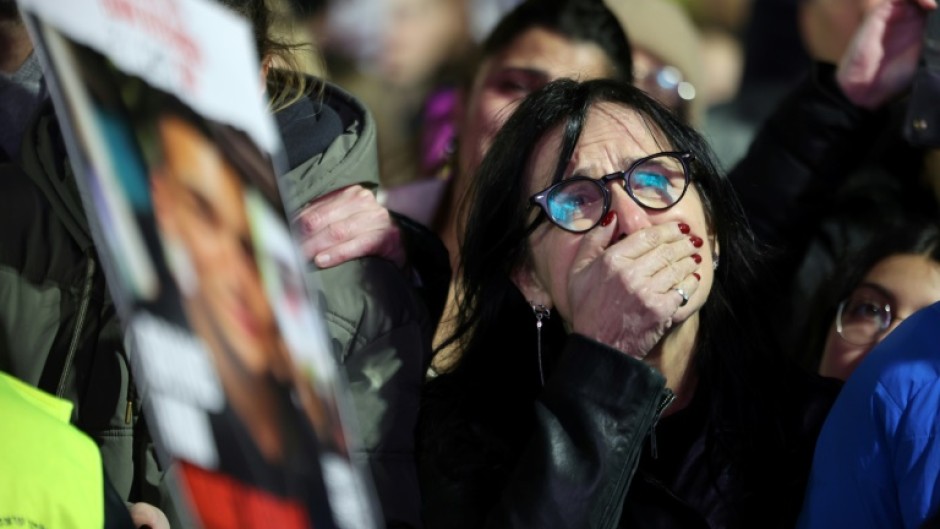 A woman reacts at 'Hostages Square' in Tel Aviv, where crowds gathered after militants in Gaza handed over the bodies of Israeli captives