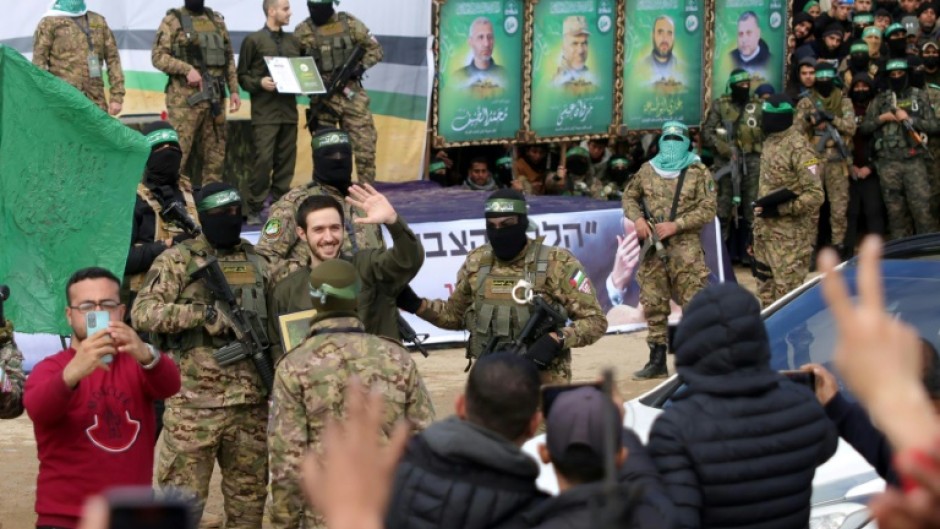 Israeli hostage Omer Shem Tov waves during the release ceremony for himself and two other captives in Nuseirat, central Gaza