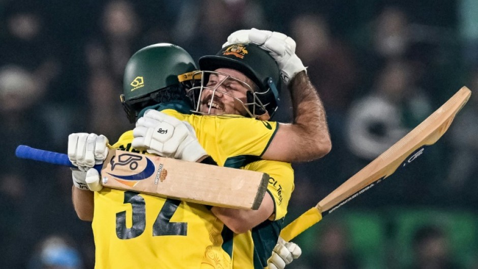 Chase masters: Australia's Josh Inglis (R) celebrates with teammate Glenn Maxwell after reaching his century