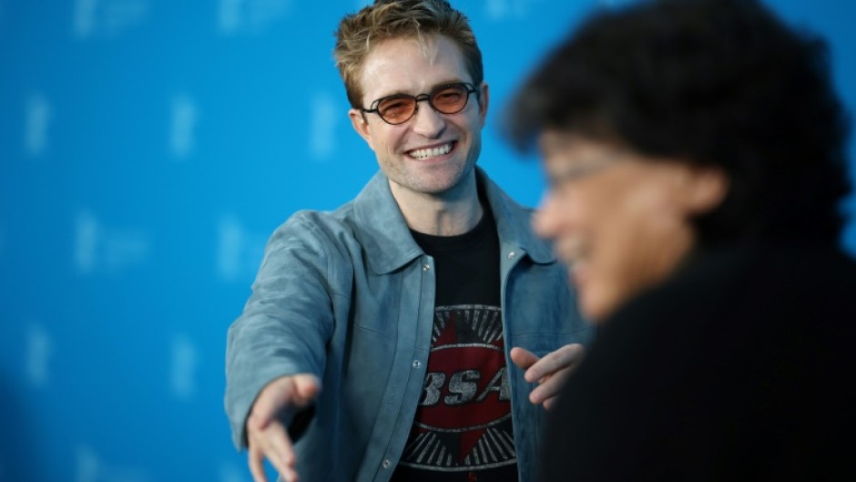 Robert Pattinson and South Korean director Bong Joon Ho pose during a photo call 