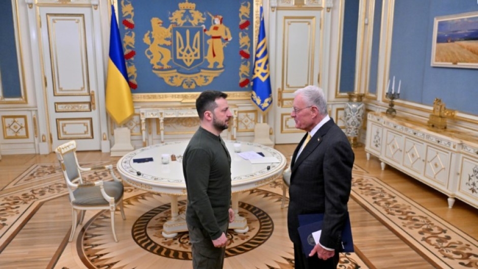 Ukraine's President Volodymyr Zelensky greets US special envoy for Ukraine Keith Kellogg at his offices in Kyiv on February 20, 2025