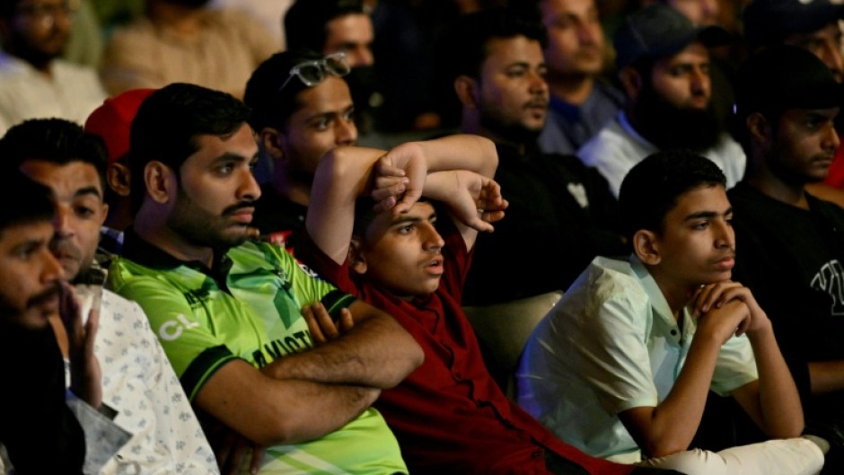 Death of a dream: Cricket fans in Karachi watch a live broadcast of the Champions Trophy match between India and Pakistan on a big screen