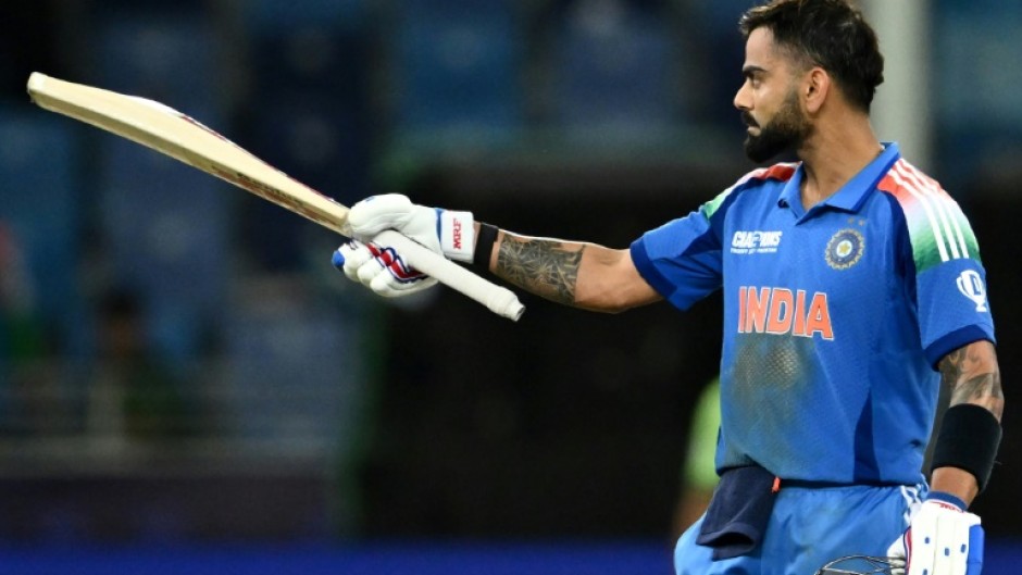 King Kohli: The India superstar celebrates scoring his century 