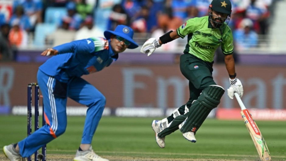 Running man: Pakistan's Saud Shakeel (R) was his team's top scorer 