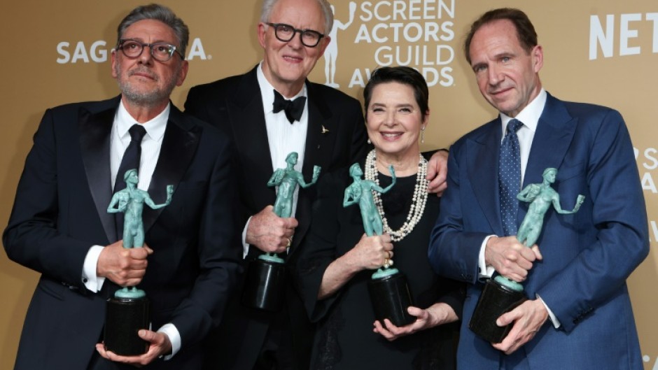 'Conclave' cast members (L-R) Sergio Castellitto, John Lithgow, Isabella Rossellini and Ralph Fiennes celebrate the film's win for best cast in a motion picture at the Screen Actors Guild Awards