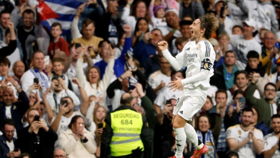 Real Madrid's Croatian midfielder Luka Modric celebrates scoring the opening goal against Girona on Sunday