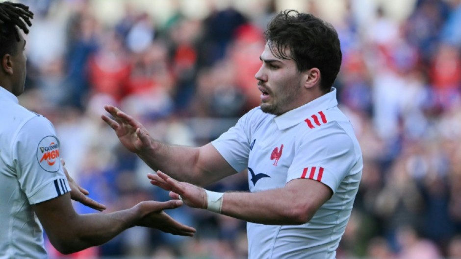 Antoine Dupont (R) scored two tries against Italy